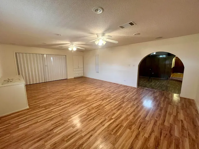 a view of a livingroom with wooden floor