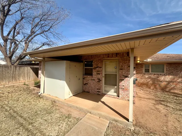 a view of a garage with wooden door