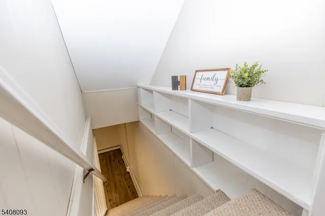 a view of staircase and utility room