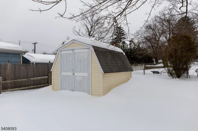 a view of backyard with seating and trees