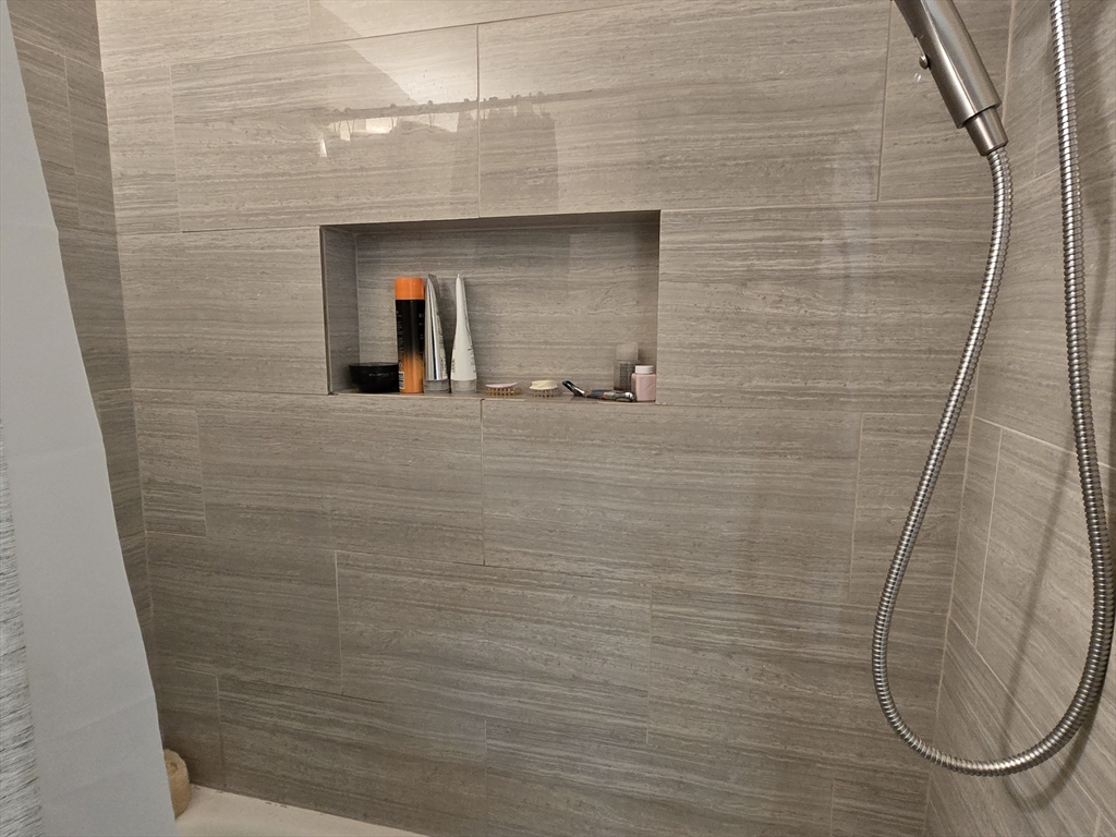 21 Beacon Street, Unit 10C Boston, MA 02108 - Photo 14 of 20 a bathroom with a shower