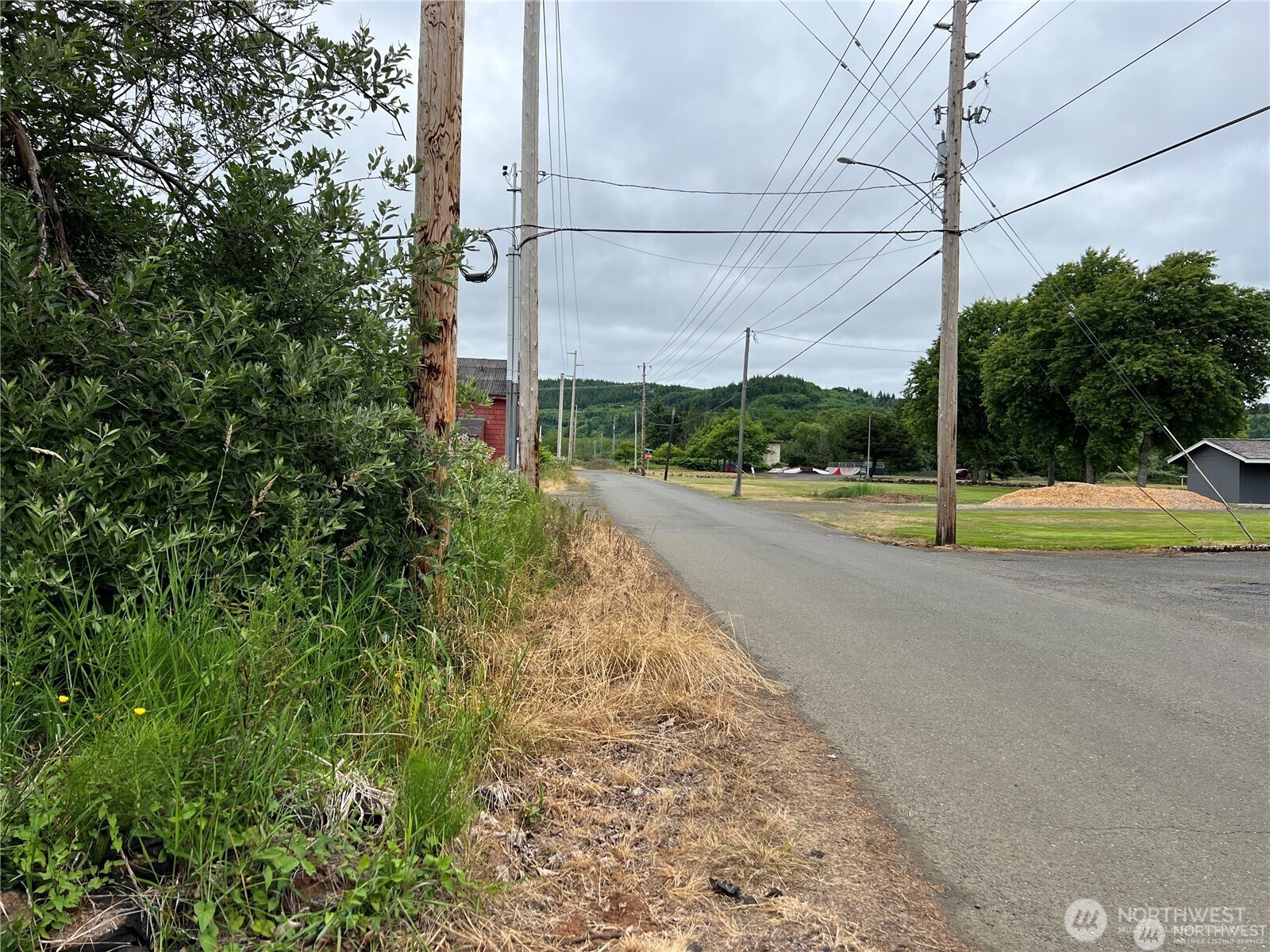 0 X Eight Street Raymond, WA 98577 - Photo 6 of 8 a view of a road with a building in the background