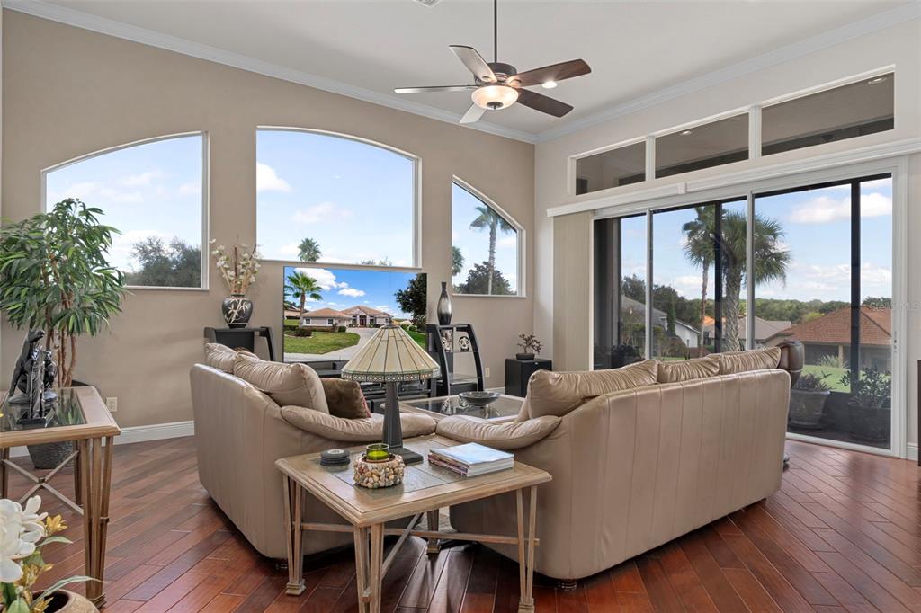 1601 North Tee Time Terrace Hernando, FL 34442 - Photo 6 of 69 a living room with furniture large windows and wooden floor