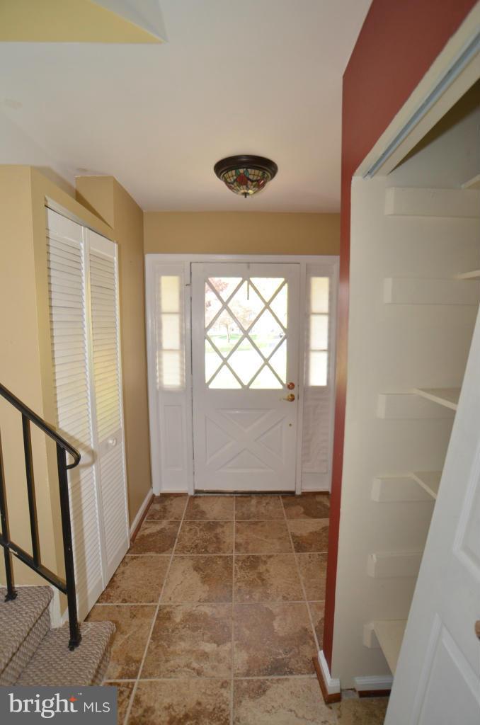 6711 Garrett Road Derwood, MD 20855 - Photo 12 of 21 a view of empty room with wooden floor and fan