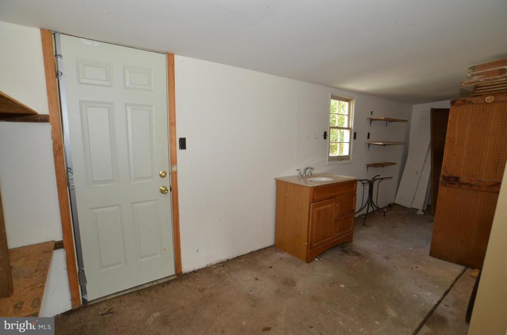 6711 Garrett Road Derwood, MD 20855 - Photo 14 of 21 a view of a storage & utility room with a sink
