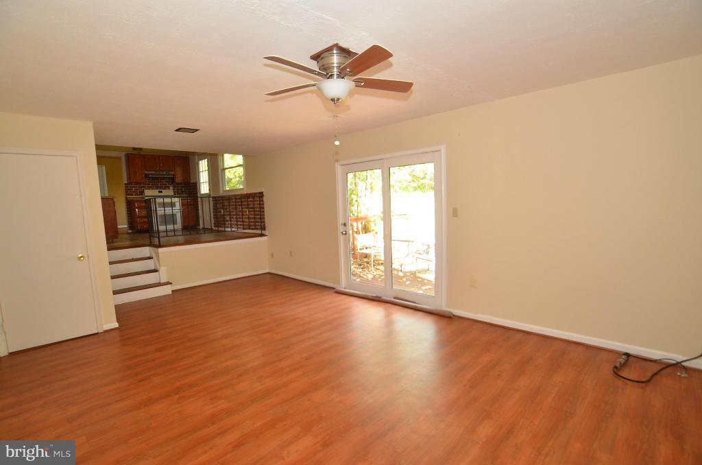 6711 Garrett Road Derwood, MD 20855 - Photo 10 of 21 wooden floor in an empty room with a window