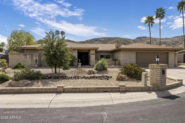 a view of a house with a street