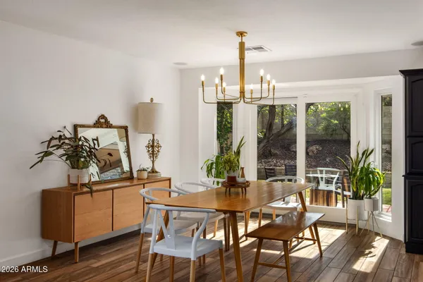 a view of a dining room with furniture window and outside view