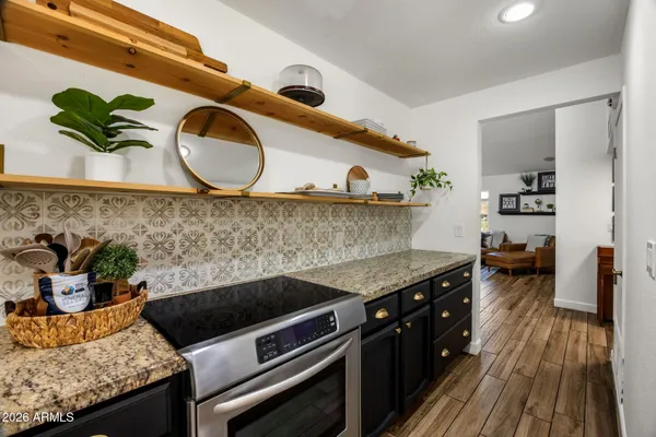 a kitchen with a stove and cabinets