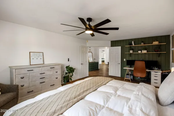 a bedroom with a bed and furniture