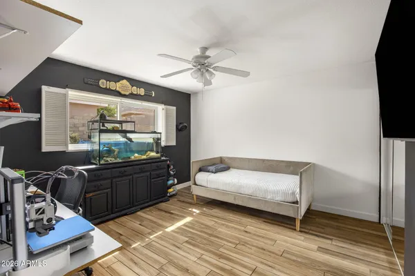 a room with a bed and furniture