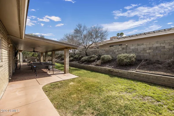 a view of swimming pool with outdoor seating