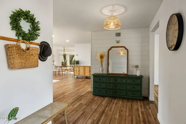 a view of entryway with wooden floor