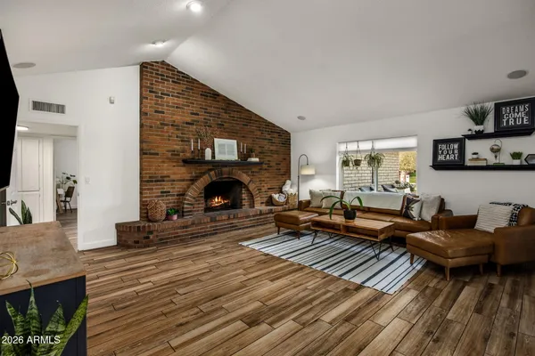 a living room with furniture and a fireplace