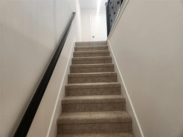 a view of a bathroom from a hallway