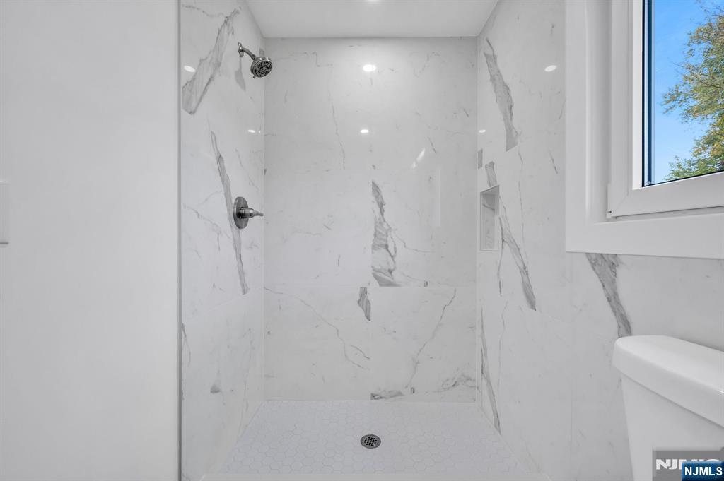 378 Marvin Avenue Hackensack, NJ 07601 - Photo 18 of 46 a bathroom with a shower and toilet