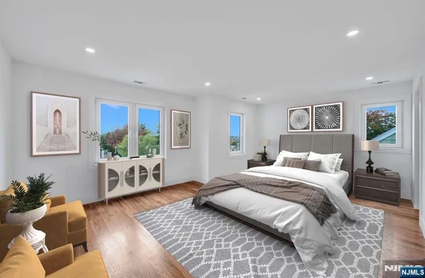 a bedroom with a large bed and a couch