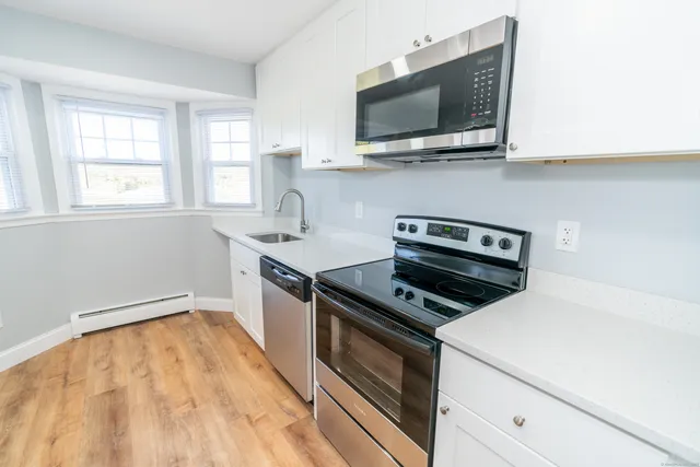 a kitchen with a stove and a microwave