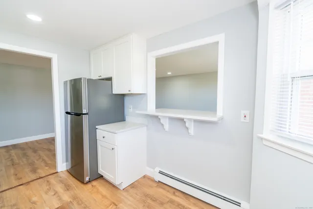 a kitchen with a refrigerator and countertop
