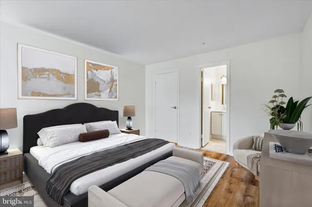 a bedroom with a bed and a couch