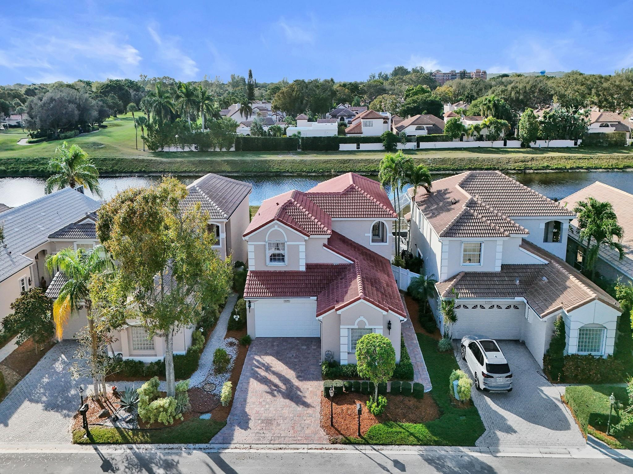 an aerial view of a house with garden view and lake view