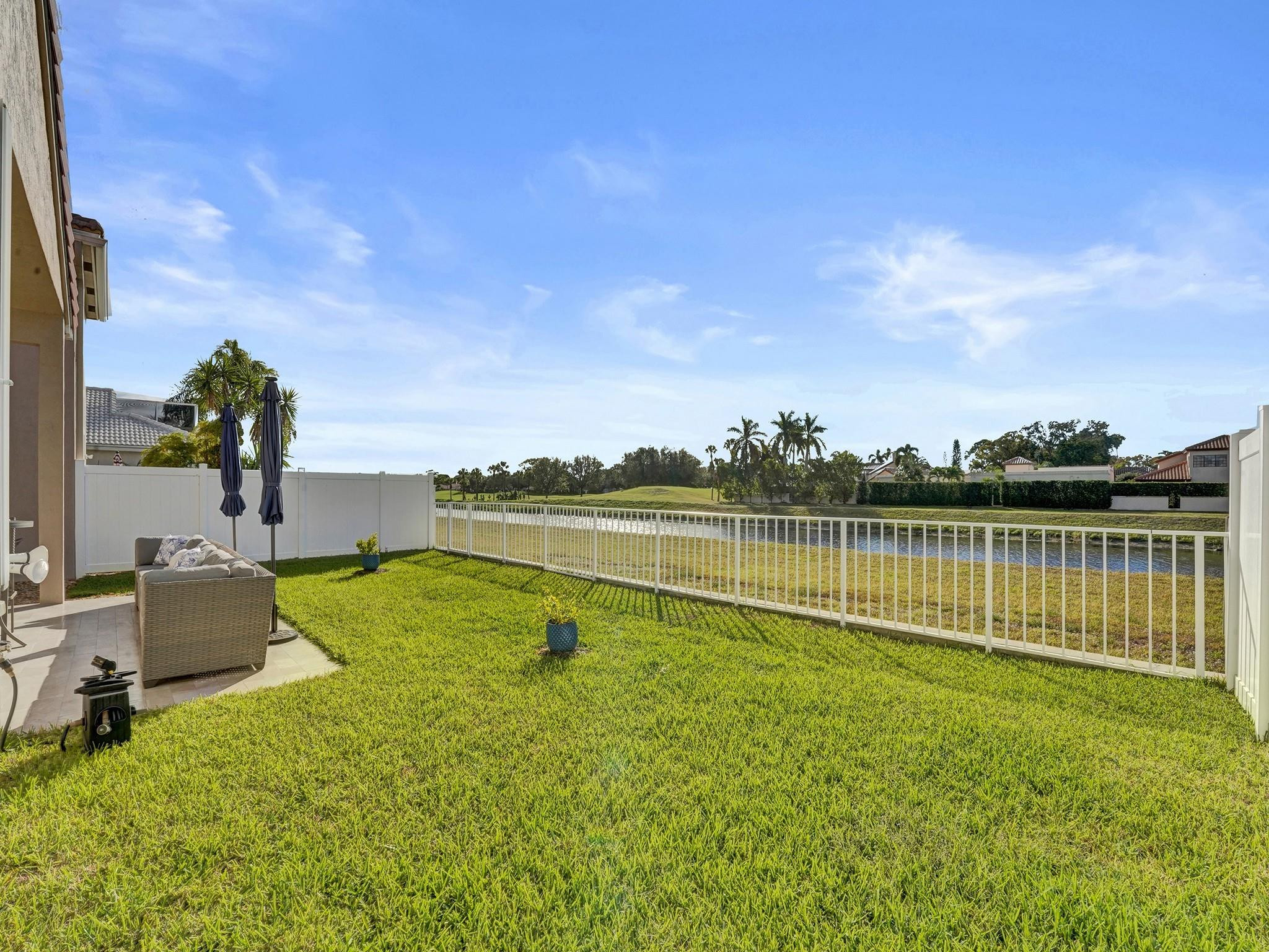 6298 Brava Way Boca Raton, FL 33433 - Photo 16 of 91 a view of a lake with a big yard