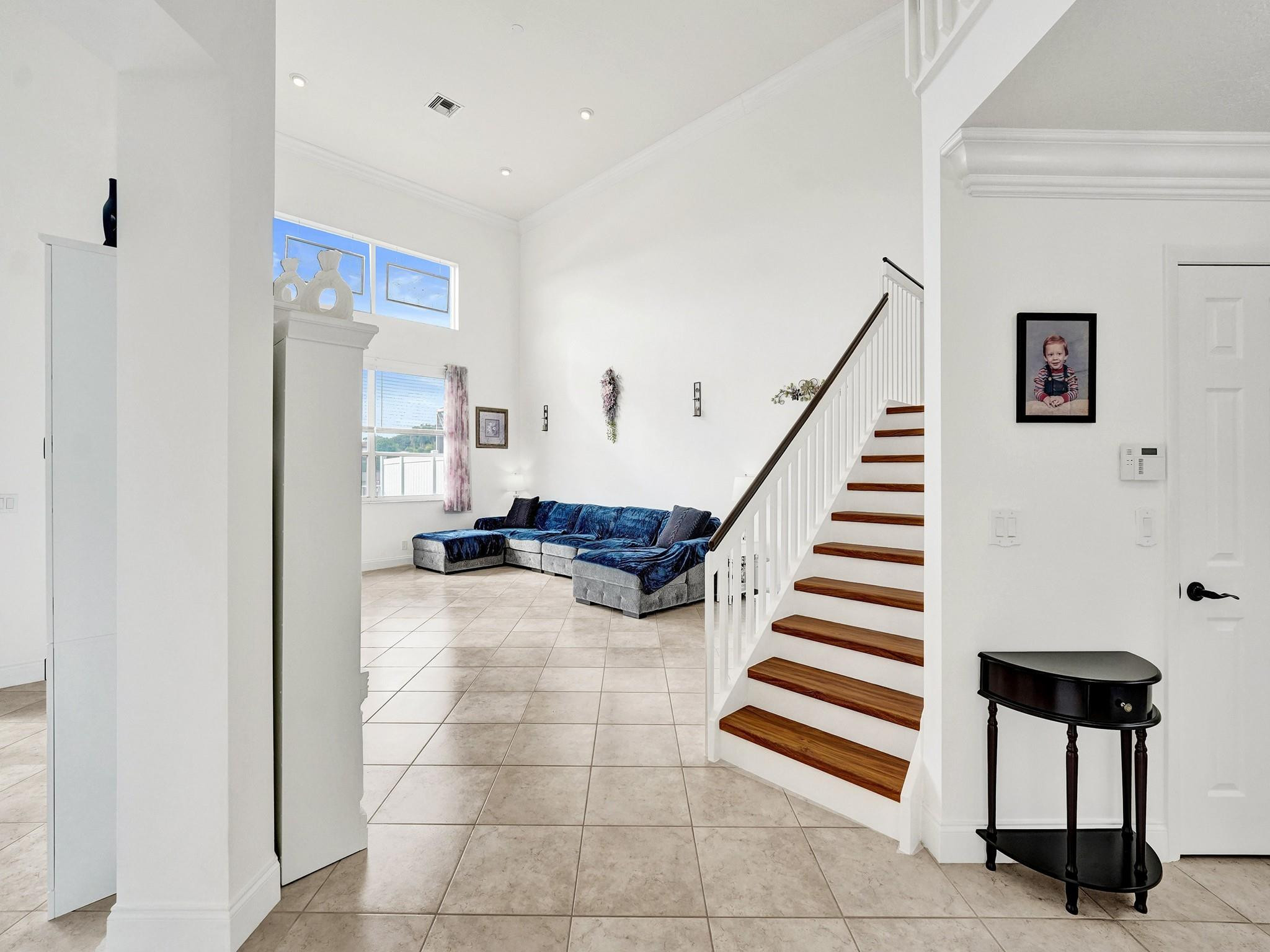 6298 Brava Way Boca Raton, FL 33433 - Photo 19 of 91 a view of entryway and hall with dining room
