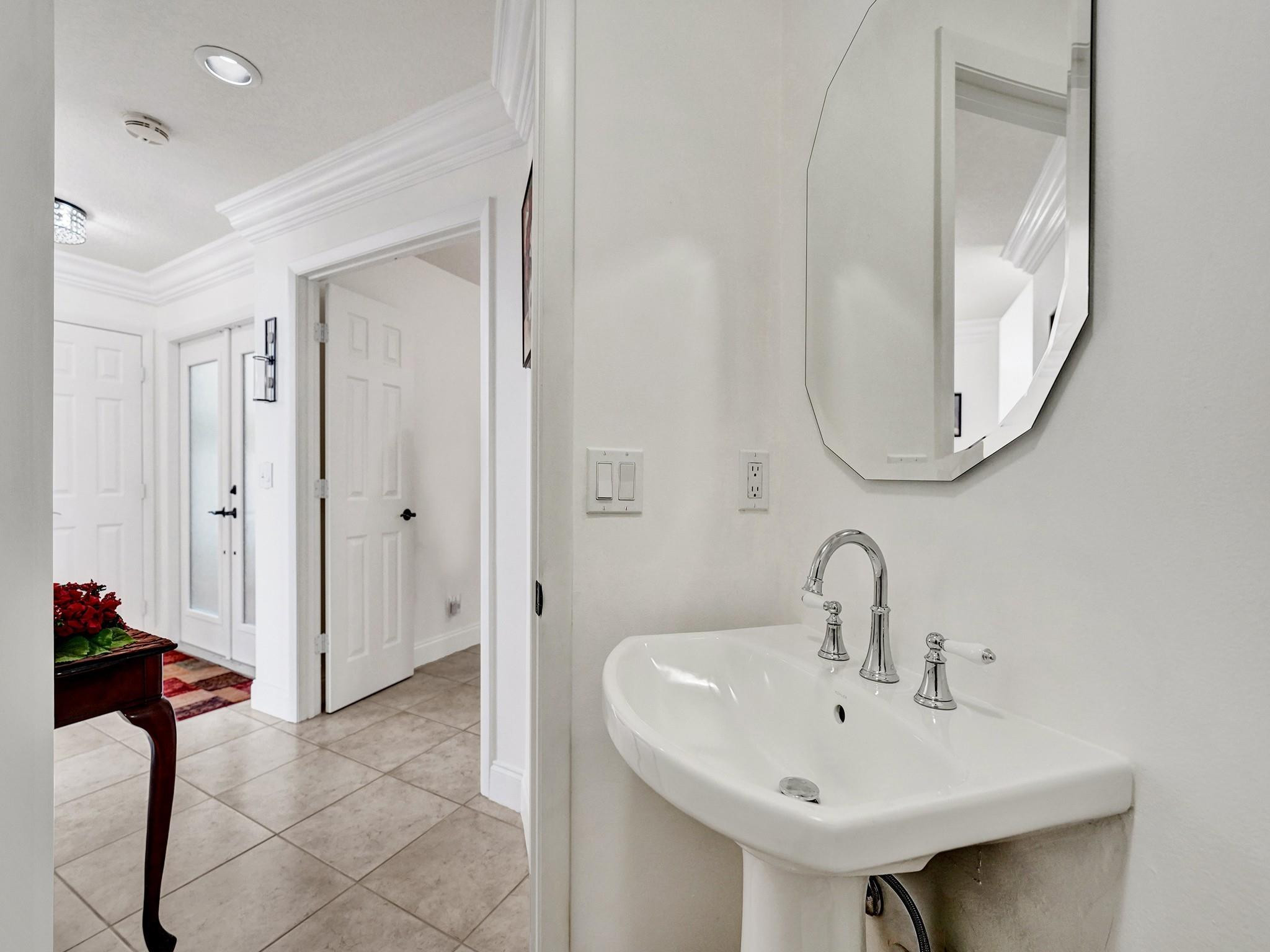 6298 Brava Way Boca Raton, FL 33433 - Photo 43 of 91 a bathroom with a sink and a mirror