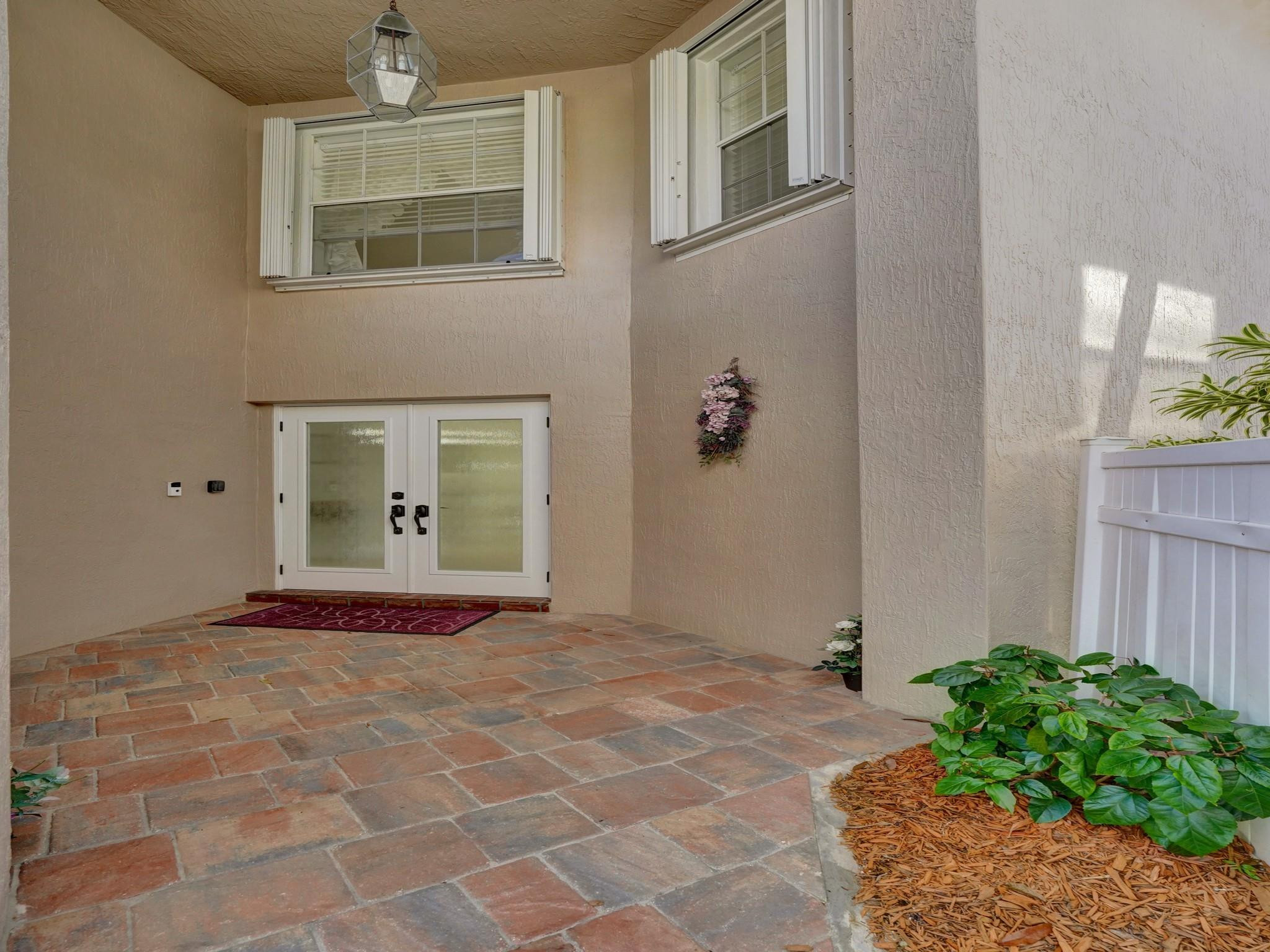 6298 Brava Way Boca Raton, FL 33433 - Photo 66 of 91 a front view of a house with a yard