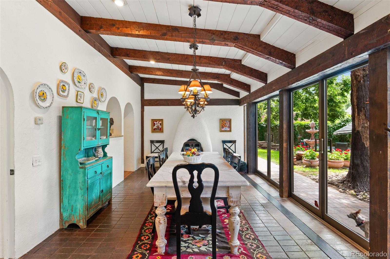 50 Albion Street Denver, CO 80220 - Photo 2 of 49 a view of a hallway with wooden floor and a chandelier