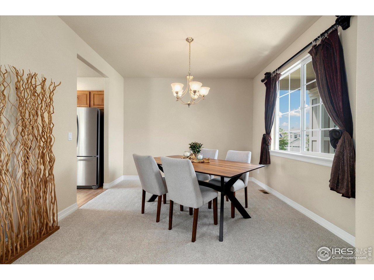 16836 Roberts Street Mead, CO 80542 - Photo 13 of 27 a dining room with furniture and window