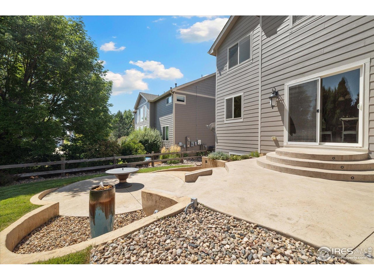 16836 Roberts Street Mead, CO 80542 - Photo 15 of 27 a swimming pool with outdoor seating and yard