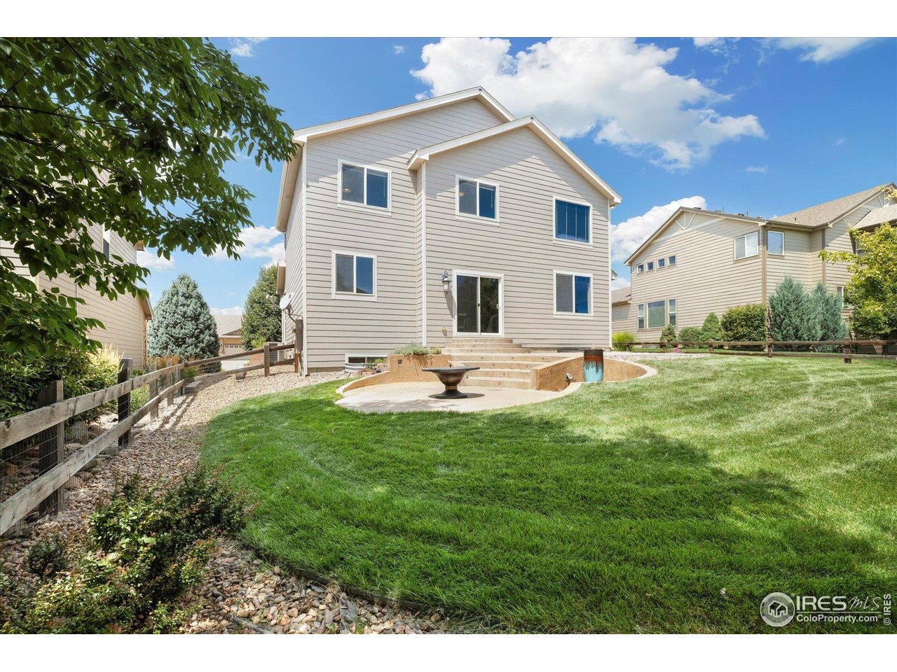 16836 Roberts Street Mead, CO 80542 - Photo 16 of 27 a view of a house with backyard and sitting area