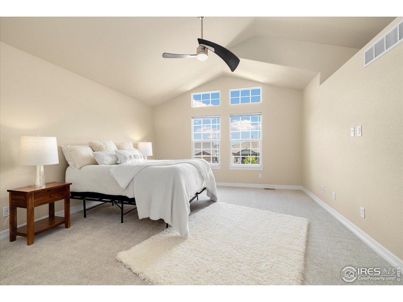 16836 Roberts Street Mead, CO 80542 - Photo 20 of 27 a bedroom with a bed and a large window