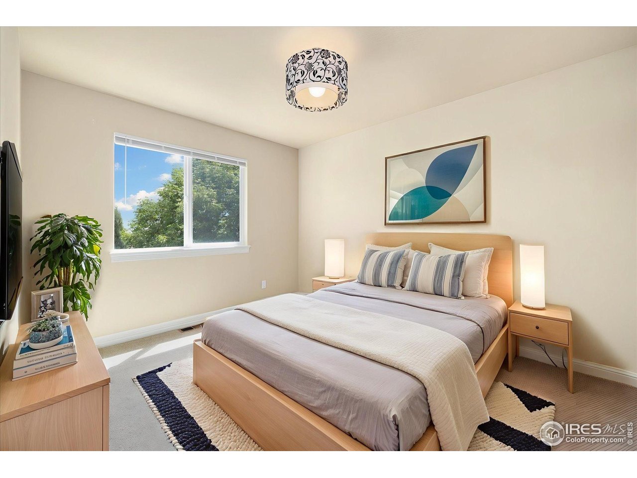 16836 Roberts Street Mead, CO 80542 - Photo 26 of 27 a bedroom with a bed and a window