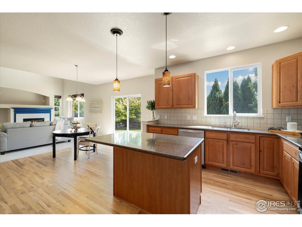 16836 Roberts Street Mead, CO 80542 - Photo 4 of 27 a kitchen with stainless steel appliances granite countertop sink stove and refrigerator