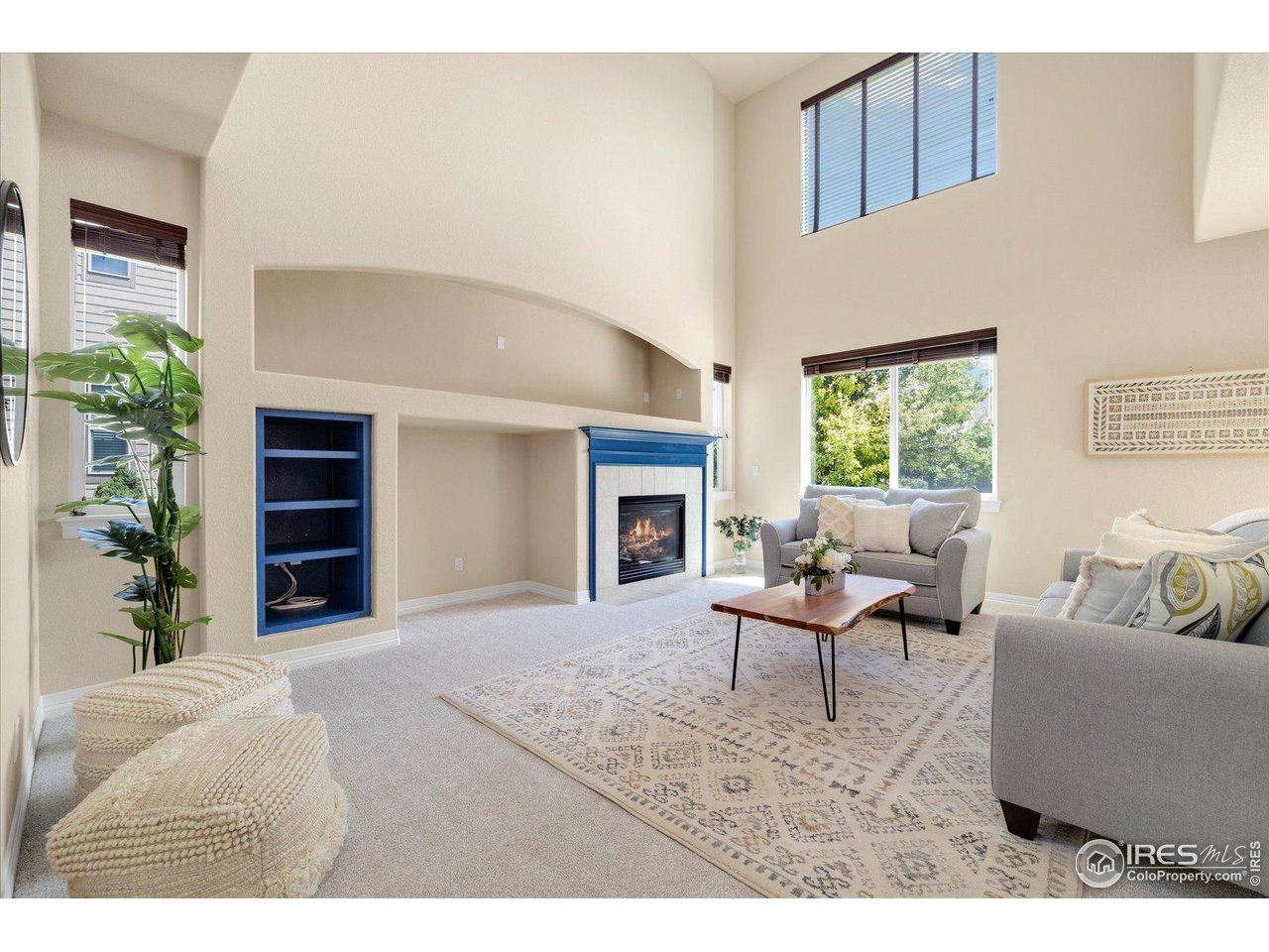 16836 Roberts Street Mead, CO 80542 - Photo 7 of 27 a living room with furniture and a fireplace