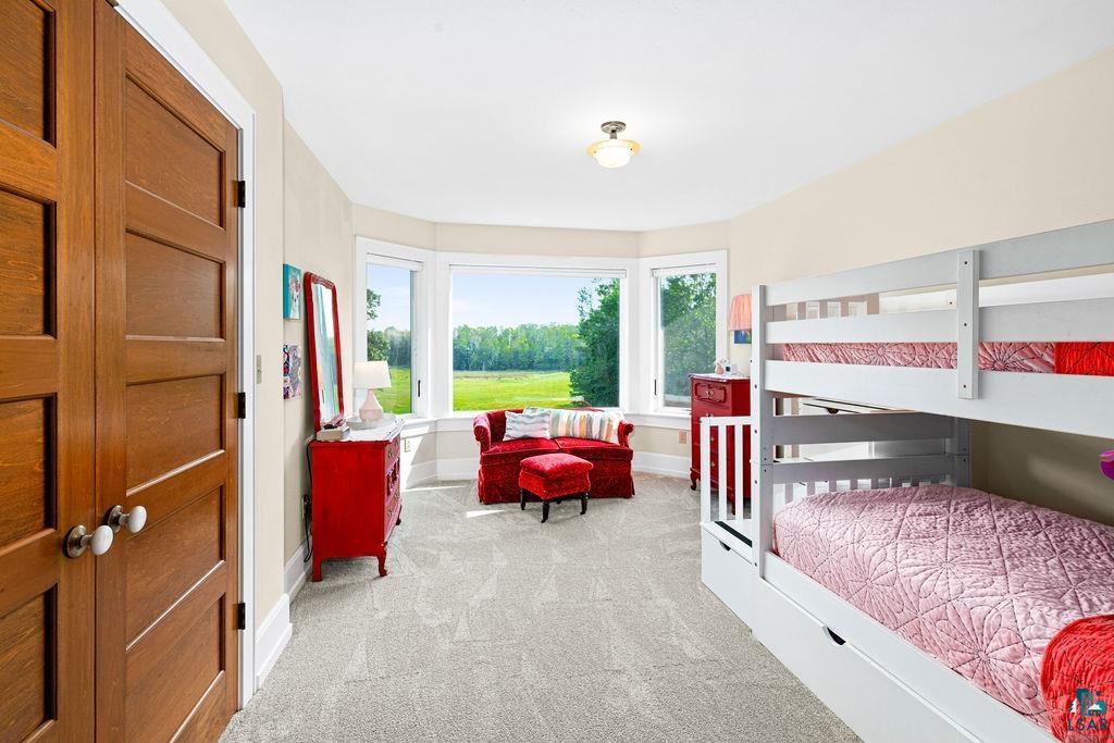 3168 Pioneer Road Barnum, MN 55707 - Photo 33 of 46 This upper level bedroom is quite large. With it's bay windows, it often provides the best views from the whole house. Wake up to views of deer bedded down in the back yard and fall asleep to a moonlight snowcapped sea.