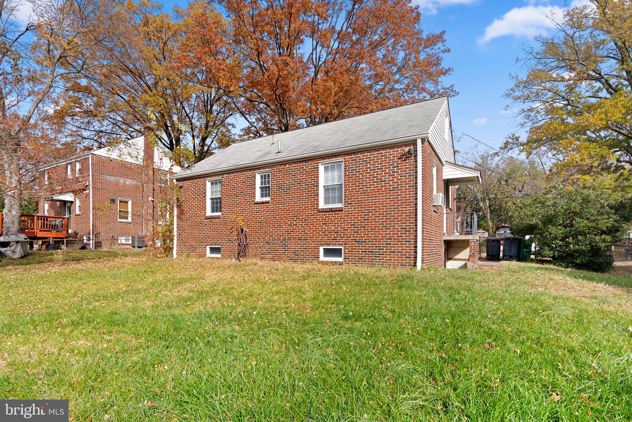 3403 Lancer Drive Hyattsville, MD 20782 - Photo 24 of 24 a backyard of a house with table and chairs
