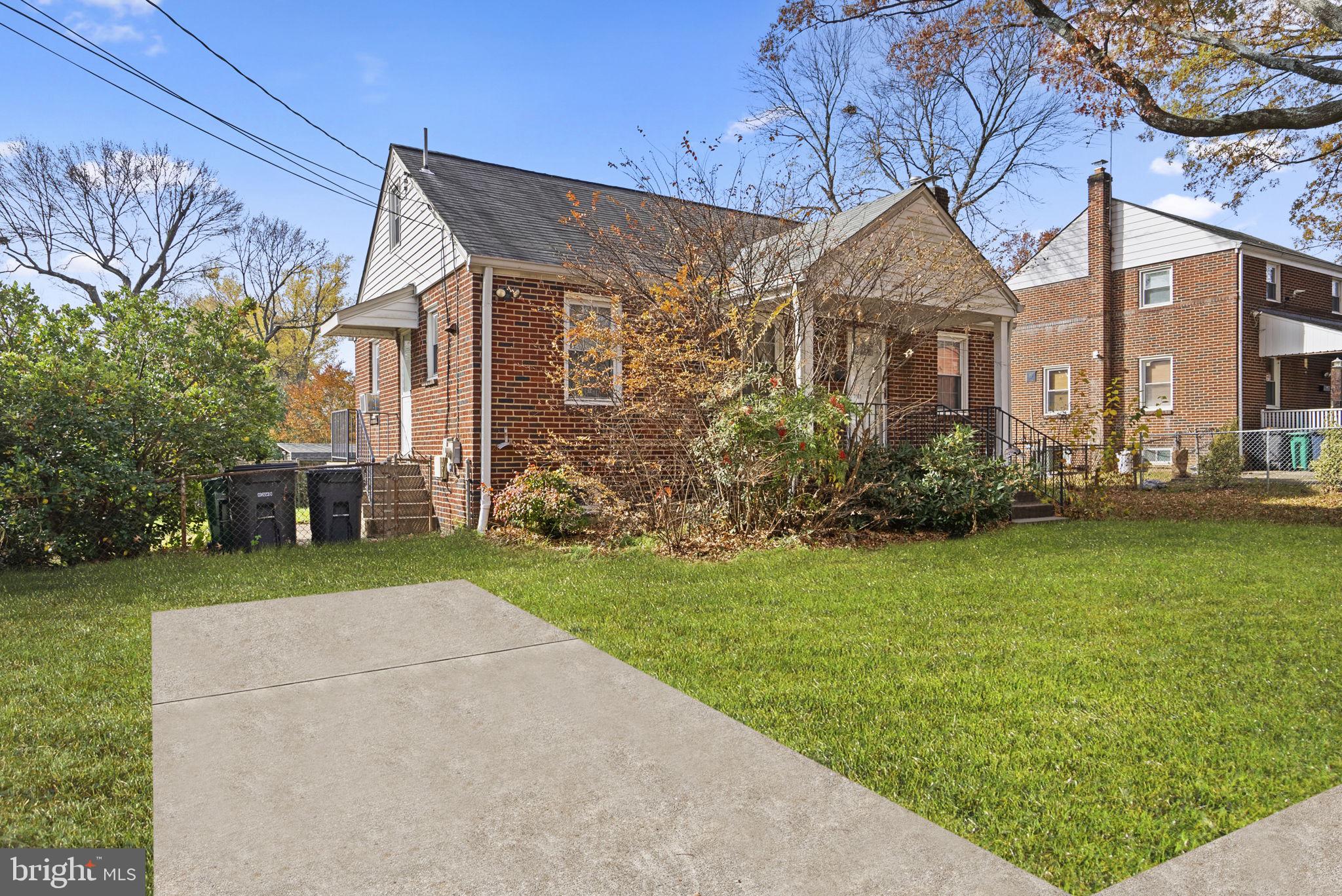 3403 Lancer Drive Hyattsville, MD 20782 - Photo 3 of 24 a front view of a house with garden