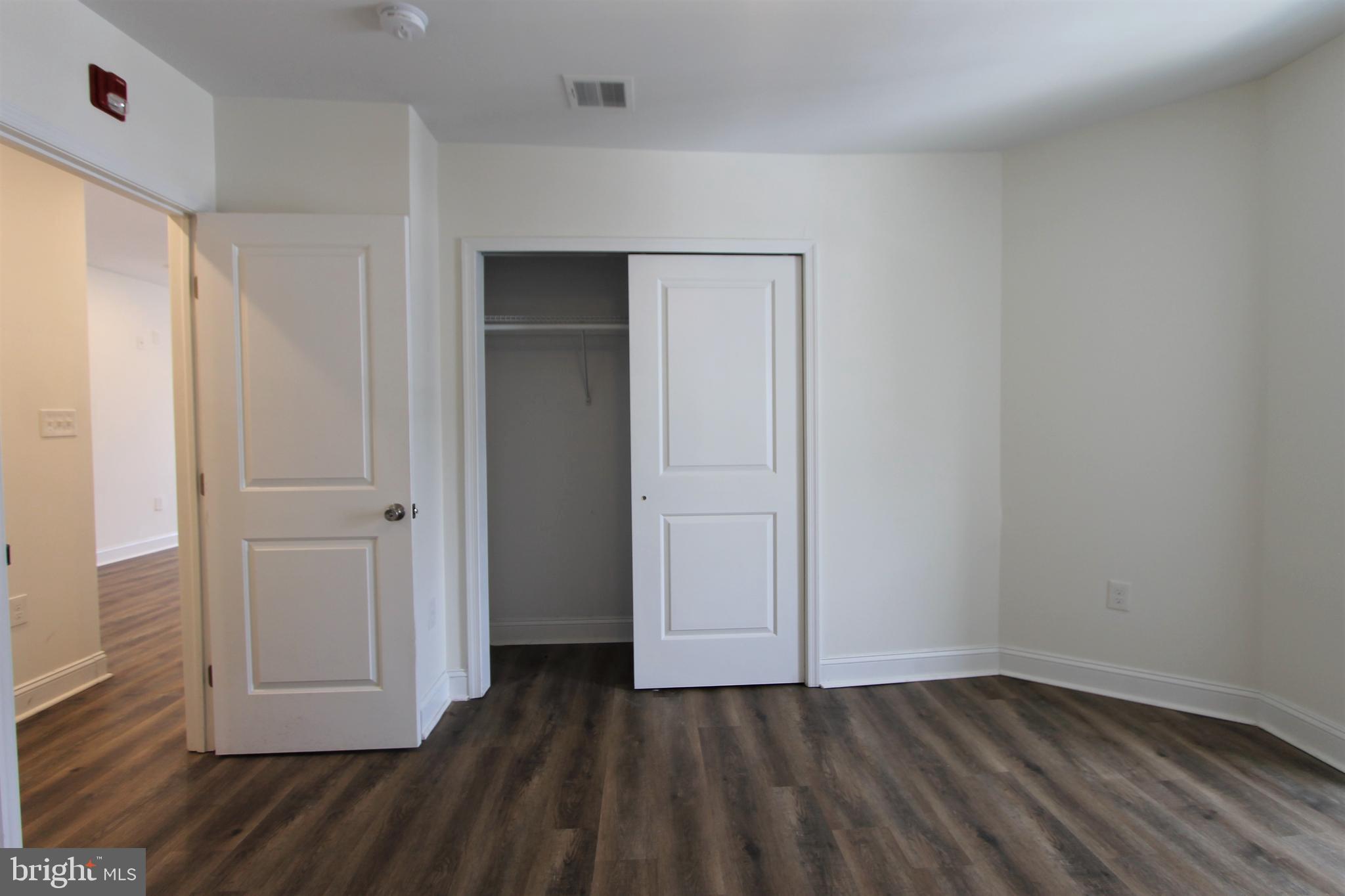 204 High Street Philadelphia, PA 19144 - Photo 12 of 19 a view of an empty room with wooden floor and closet
