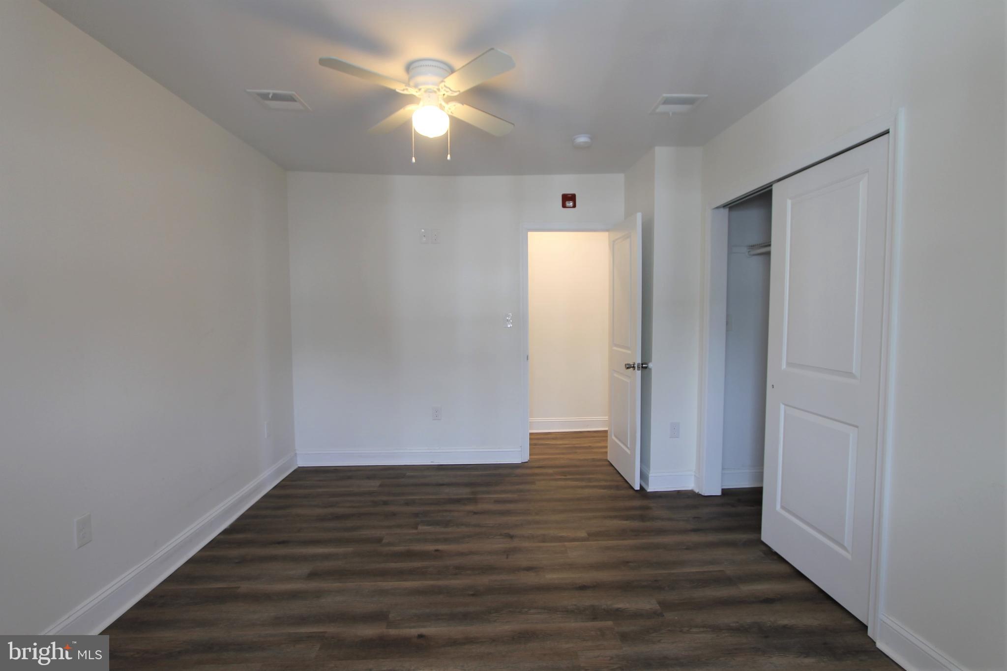 204 High Street Philadelphia, PA 19144 - Photo 13 of 19 an empty room with wooden floor and window