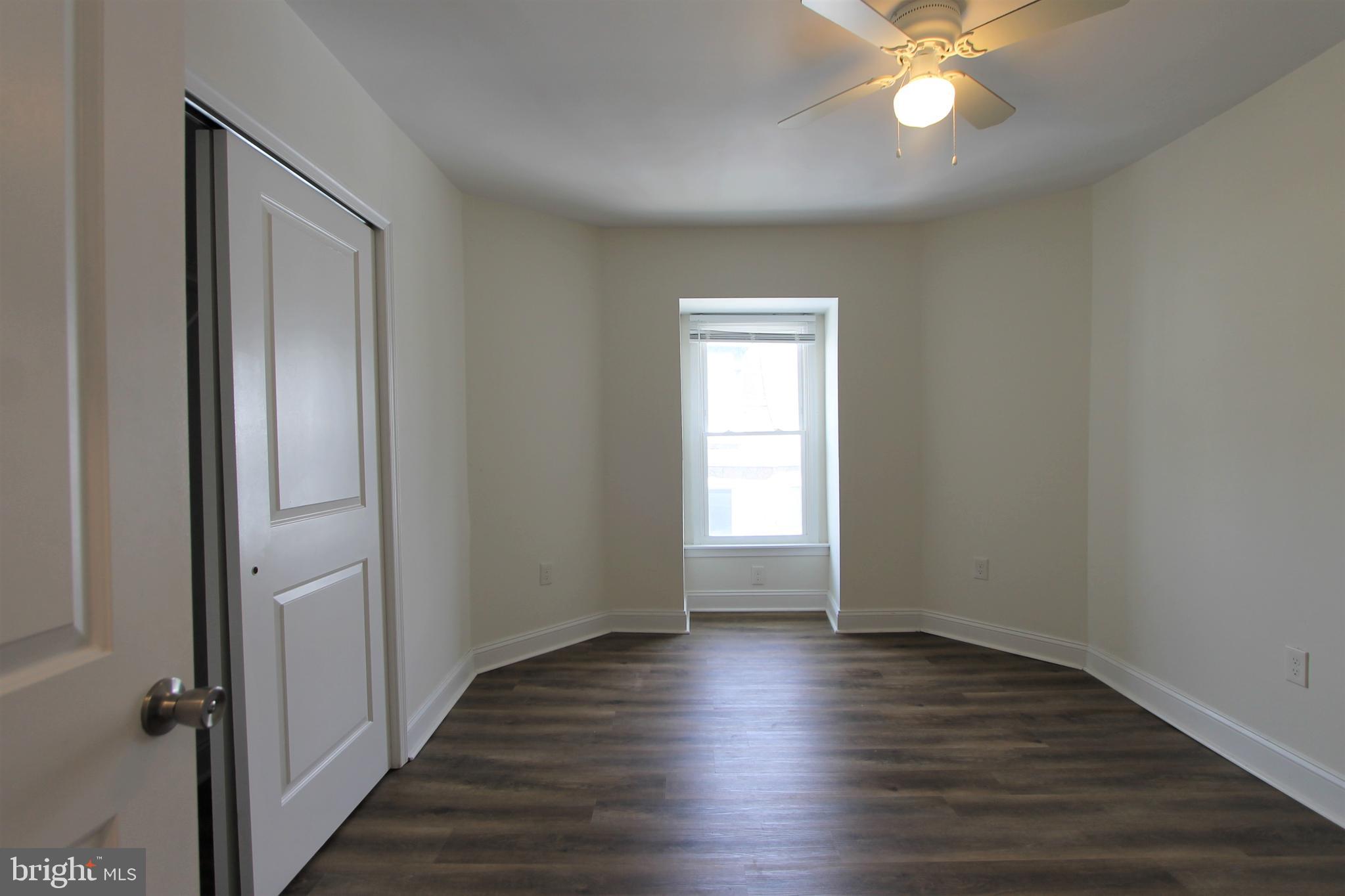 204 High Street Philadelphia, PA 19144 - Photo 14 of 19 wooden floor in an empty room with a window