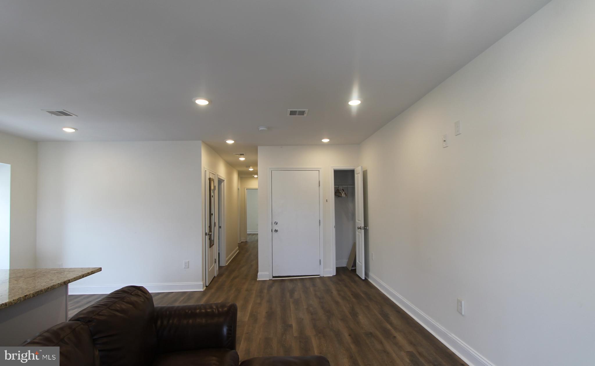204 High Street Philadelphia, PA 19144 - Photo 2 of 19 a living room with furniture and a wooden floor