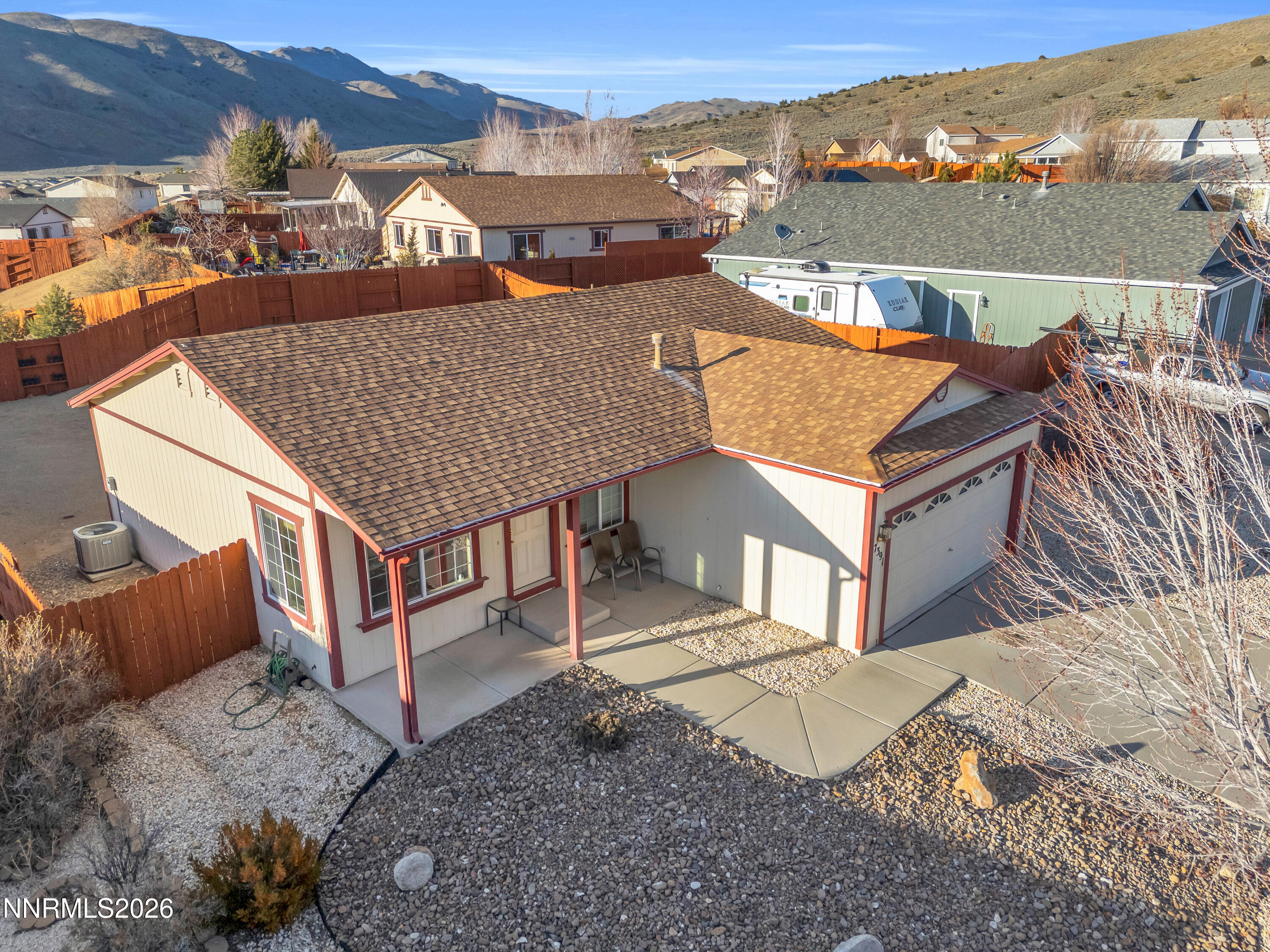 an aerial view of a house with a yard and balcony