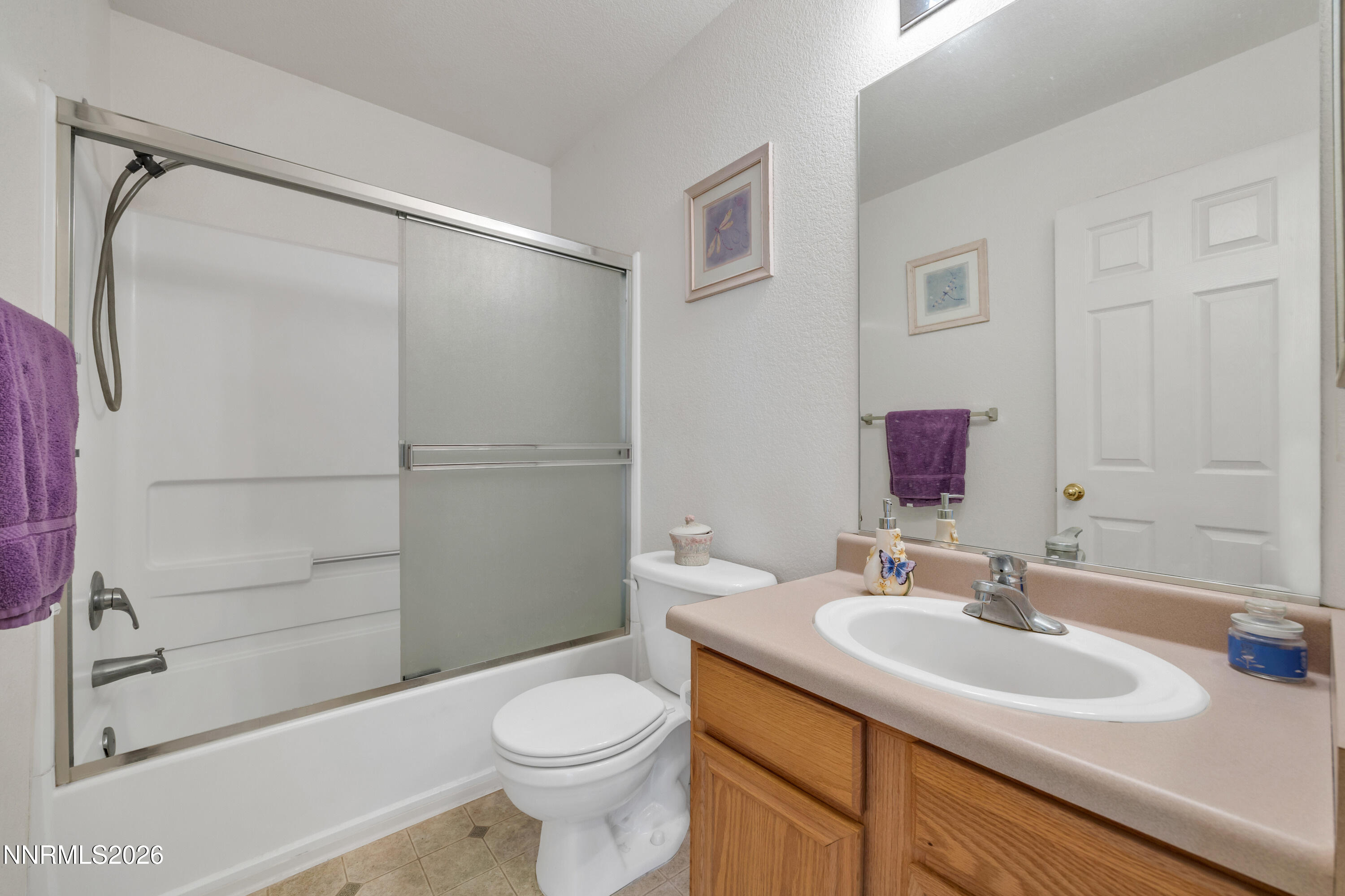 17391 Desert Lake Drive Reno, NV 89508 - Photo 21 of 39 a bathroom with a sink toilet and shower