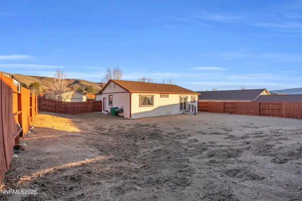 a house view with a backyard space