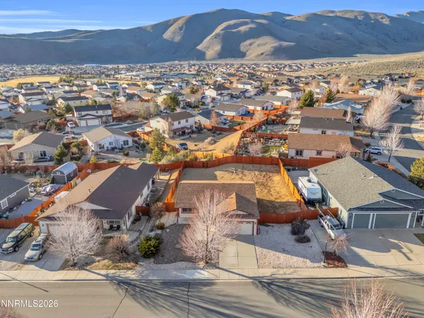 an aerial view of residential houses with outdoor space