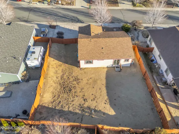 an aerial view of residential houses with outdoor space