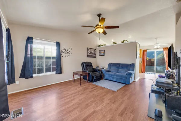 a living room with furniture and a window